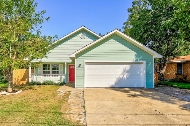 2306 W St, Taylor, TX 76574 - view of front of house featuring a garage, covered porch, concrete driveway, and a front yard