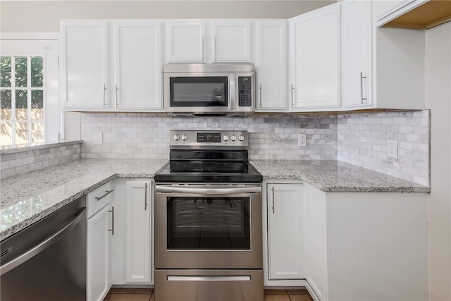 2306 W St, Taylor, TX 76574 - kitchen featuring appliances with stainless steel finishes and white cabinetry