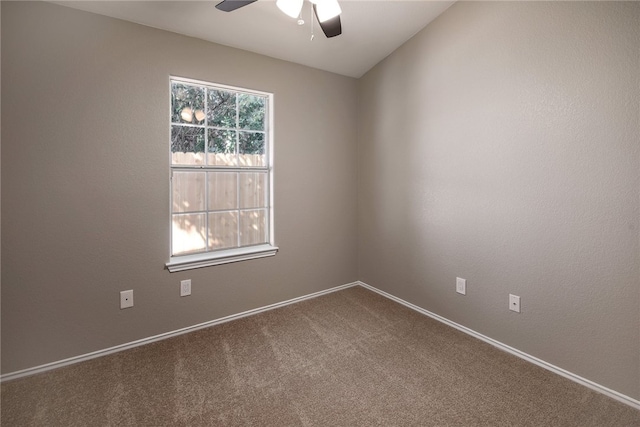 empty room featuring carpet and ceiling fan