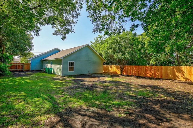 rear view of house with a lawn