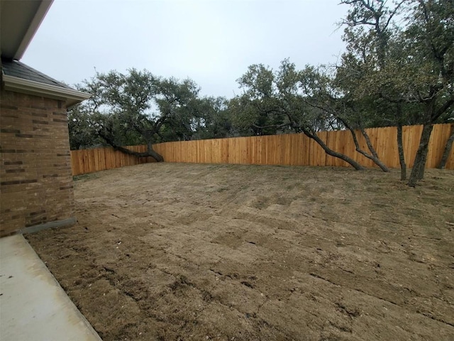 view of yard with a fenced backyard