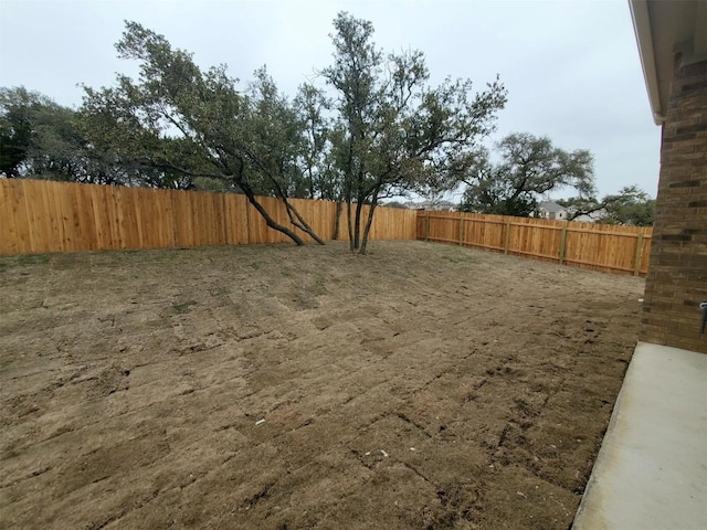 view of yard with a fenced backyard