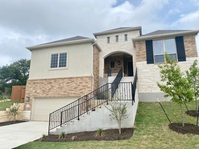 view of front of house featuring stairway, a garage, stone siding, concrete driveway, and stucco siding