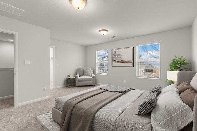 bedroom featuring light carpet