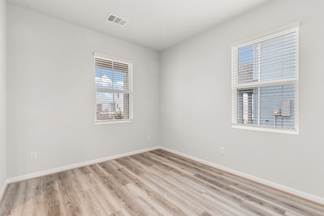 spare room with light wood-type flooring