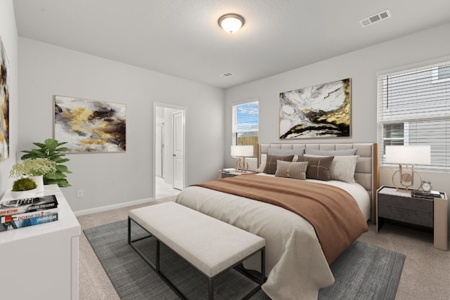 bedroom featuring light carpet