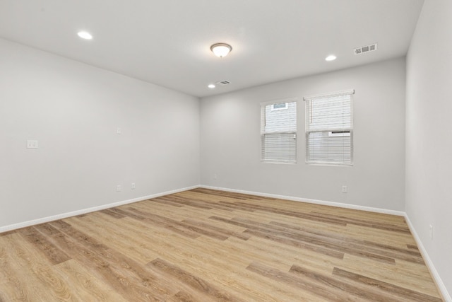 spare room featuring light hardwood / wood-style floors