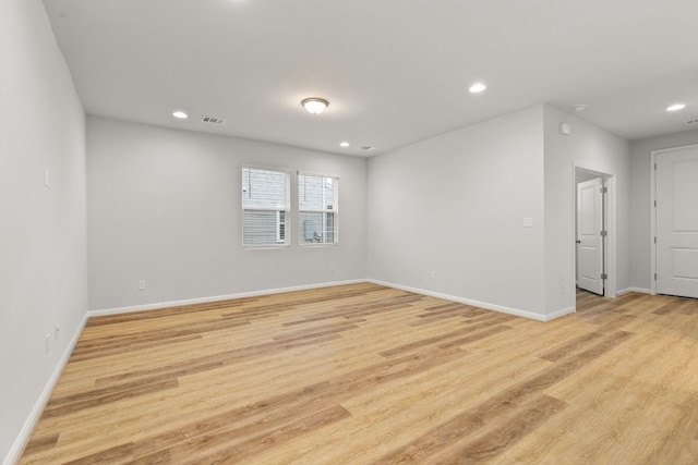 unfurnished room with light hardwood / wood-style flooring