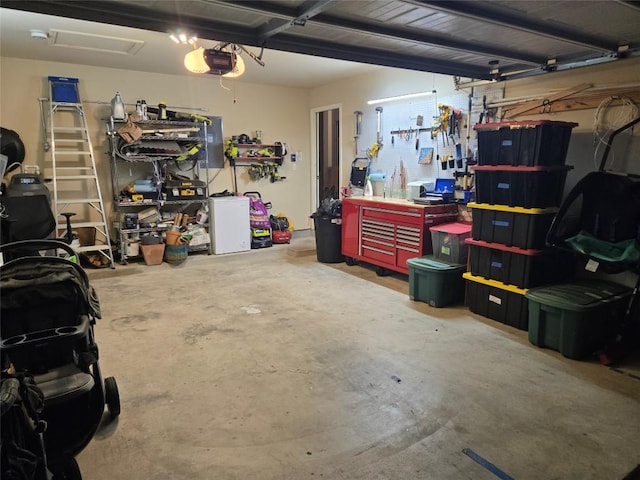 garage featuring a workshop area and a garage door opener