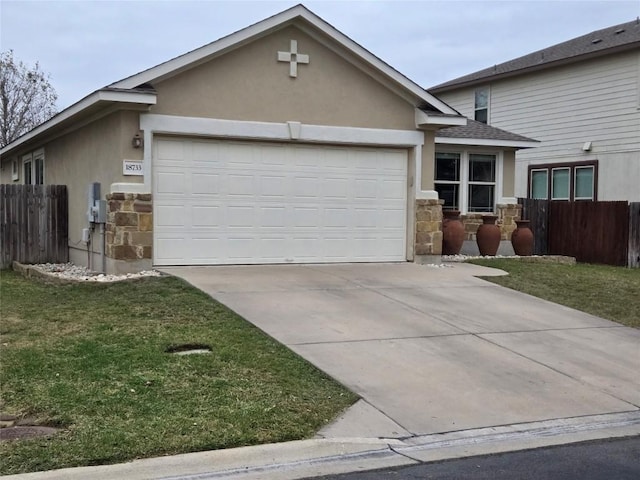 view of front of property with a garage and a front lawn