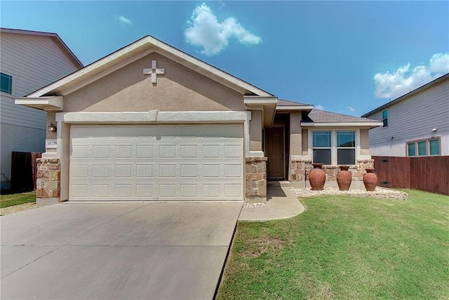 view of front of property with a front yard and a garage