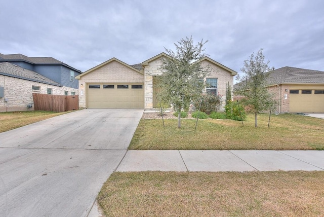 view of front of house with a front yard and a garage