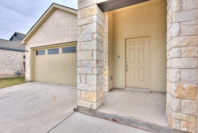 view of exterior entry featuring a garage