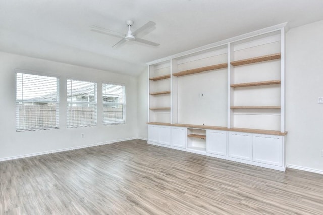 unfurnished living room with light hardwood / wood-style flooring, ceiling fan, and lofted ceiling