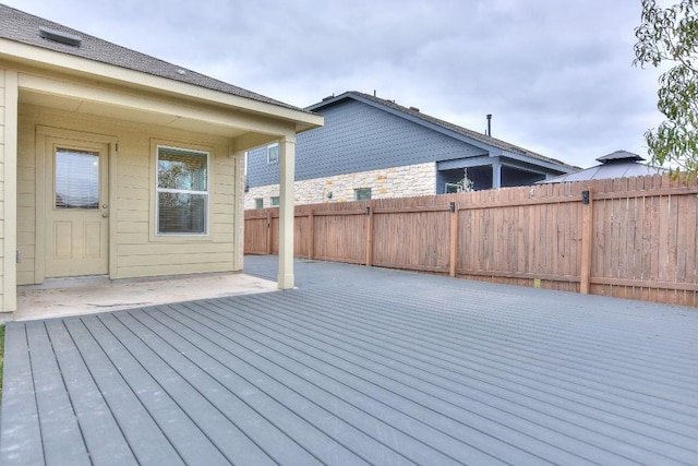 wooden terrace featuring a patio