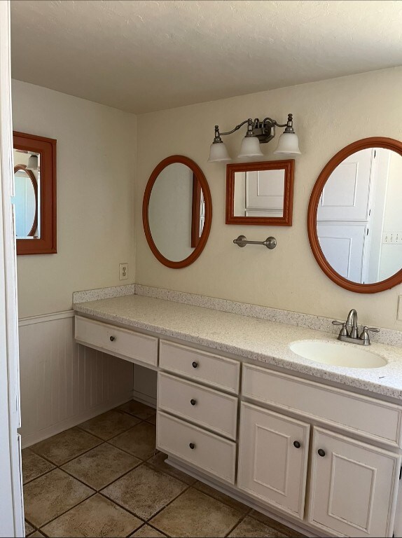 bathroom with vanity and tile patterned floors