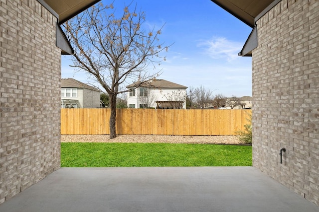 view of yard featuring a patio area and fence