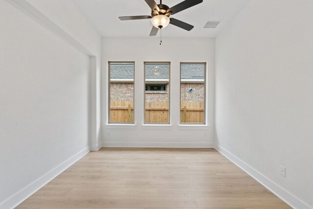 1701 Sauterne Dr, Leander, TX 78641 - spare room featuring a wealth of natural light, visible vents, light wood-style flooring, and ceiling fan