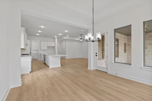 1701 Sauterne Dr, Leander, TX 78641 - interior space with light wood-type flooring, a sink, recessed lighting, baseboards, and a chandelier