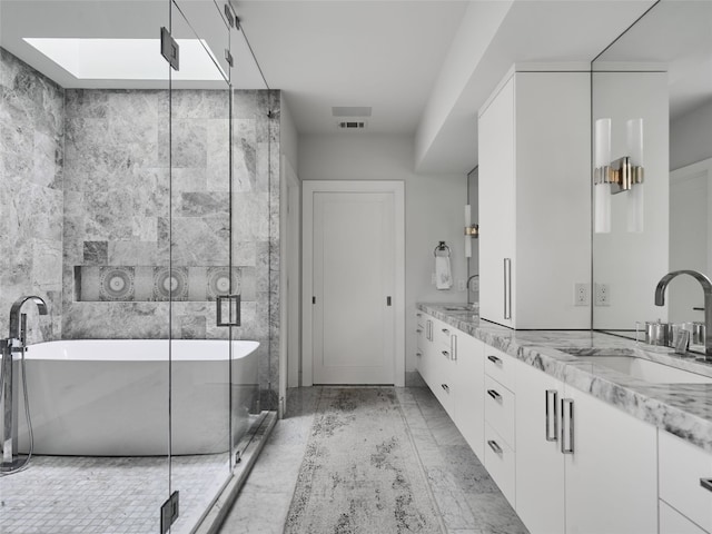 bathroom with vanity, tile walls, and independent shower and bath