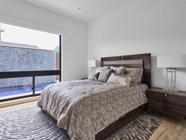 bedroom featuring hardwood / wood-style floors