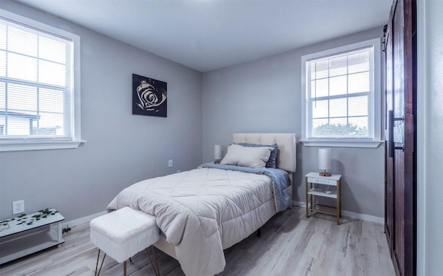 bedroom featuring light wood-type flooring