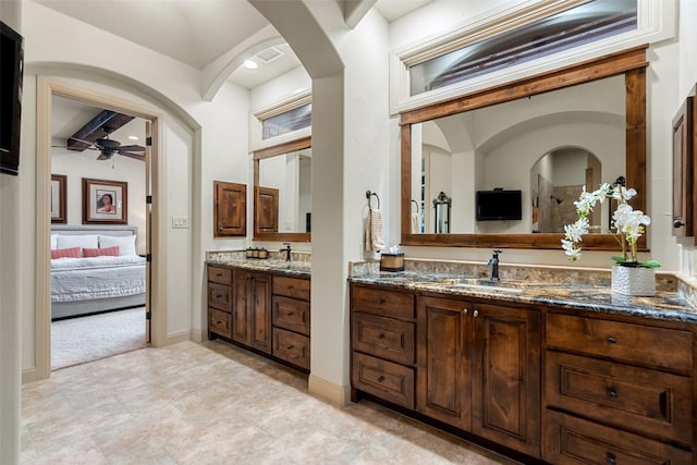 bathroom featuring beamed ceiling, vanity, and ceiling fan