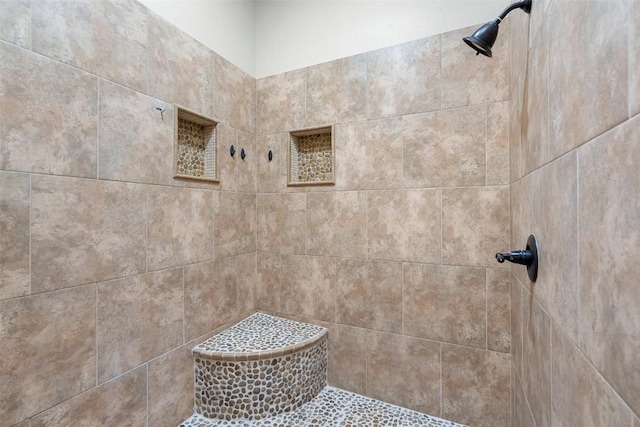 bathroom featuring tiled shower