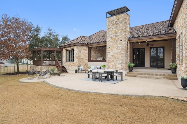 rear view of property featuring a patio area and french doors