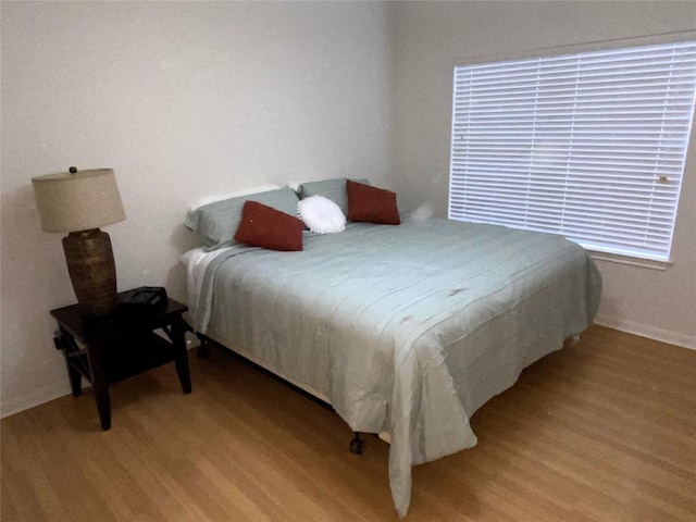 bedroom with light hardwood / wood-style floors