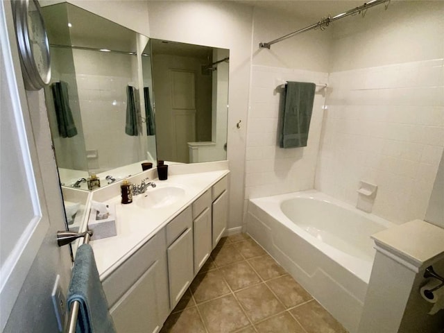 bathroom with tile patterned flooring, vanity, and bathing tub / shower combination