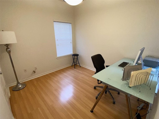 office area with hardwood / wood-style flooring