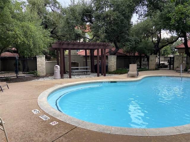 view of swimming pool featuring a pergola and a patio area