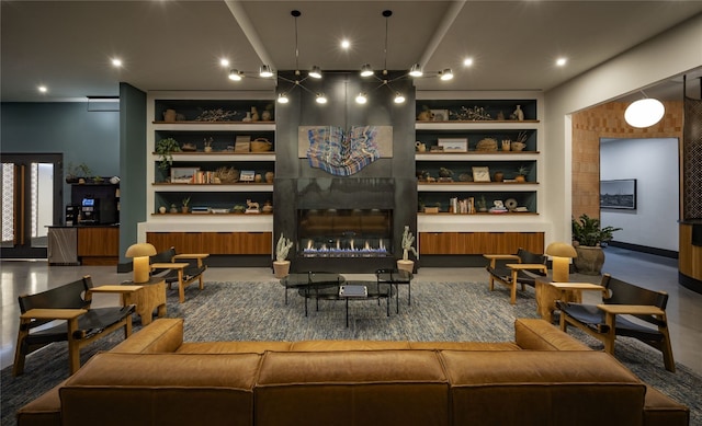 interior space with built in shelves and a fireplace