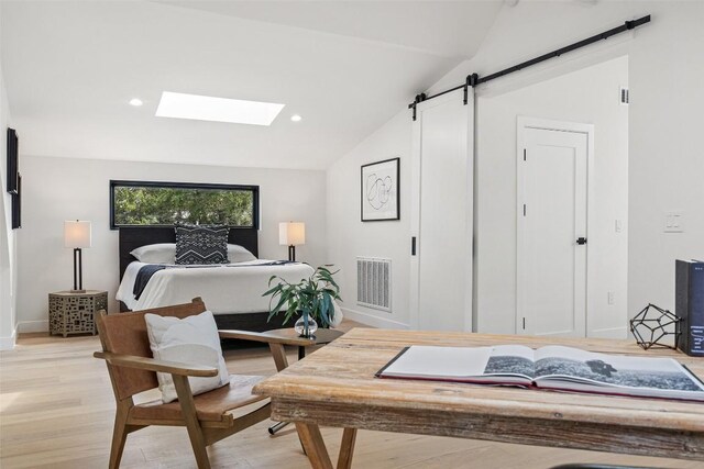 4505 Shoal Creek St, Austin, TX 78756 - bedroom featuring lofted ceiling, light wood-style flooring, a skylight, a barn door, and recessed lighting