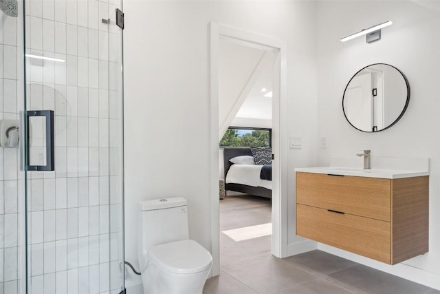 bathroom featuring an enclosed shower, vanity, and toilet