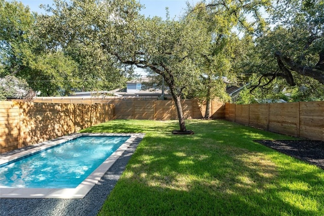 view of pool featuring a yard