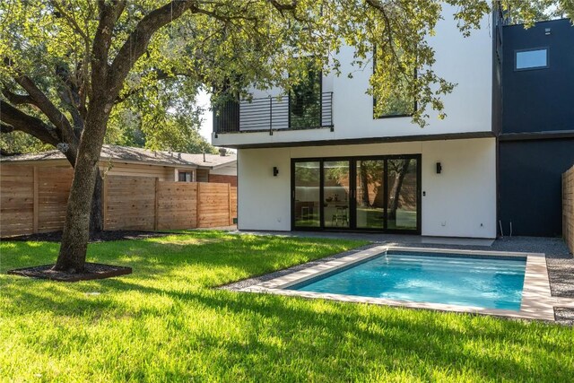 4505 Shoal Creek St, Austin, TX 78756 - rear view of house with stucco siding and an outdoor pool