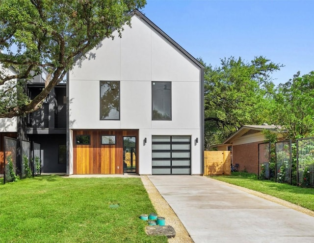 contemporary home with a front lawn