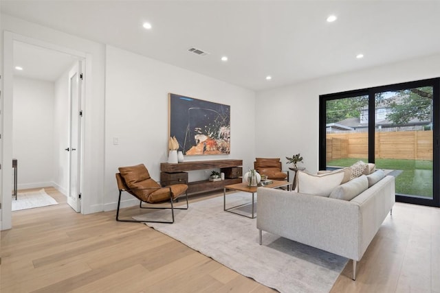 living room with light hardwood / wood-style floors