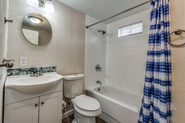 full bathroom with toilet, vanity, shower / bath combination with curtain, and a textured wall