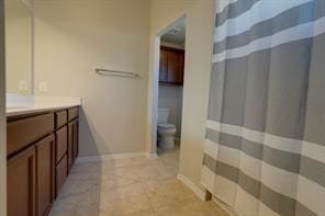 bathroom with vanity and toilet