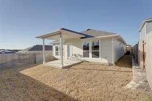 back of house with a patio