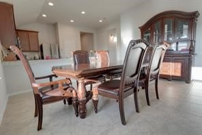 dining room with vaulted ceiling