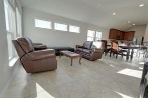 living room featuring light tile patterned floors and a wealth of natural light