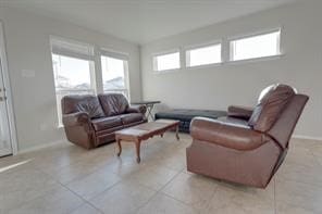 living room featuring light tile patterned floors