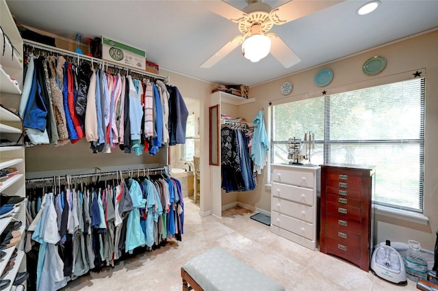 spacious closet with ceiling fan