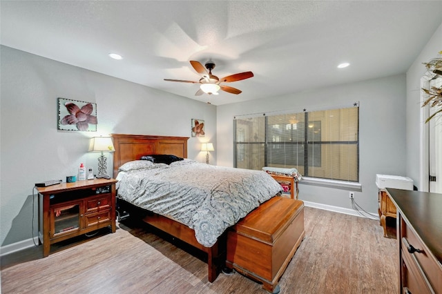 187 N Roy Chisum Rd, Leakey, TX 78873 - bedroom featuring light wood-type flooring, ceiling fan, and recessed lighting
