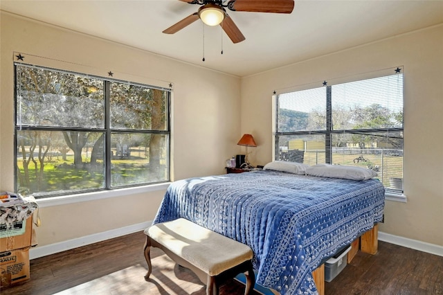 bedroom featuring ceiling fan and dark wood-type flooring