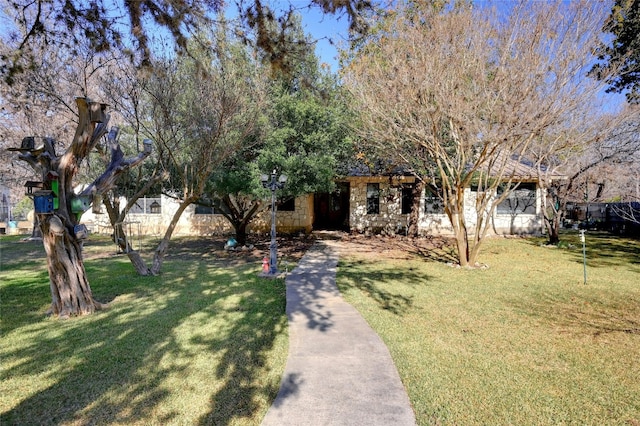 187 N Roy Chisum Rd, Leakey, TX 78873 - view of property hidden behind natural elements featuring a front lawn